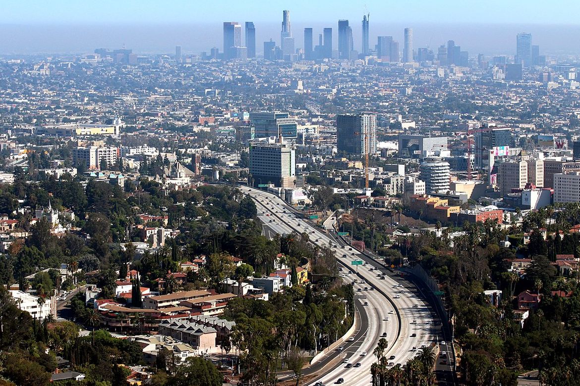 Aerial image of Hollywood Freeway with smoggy Los Angeles skyline on horizon