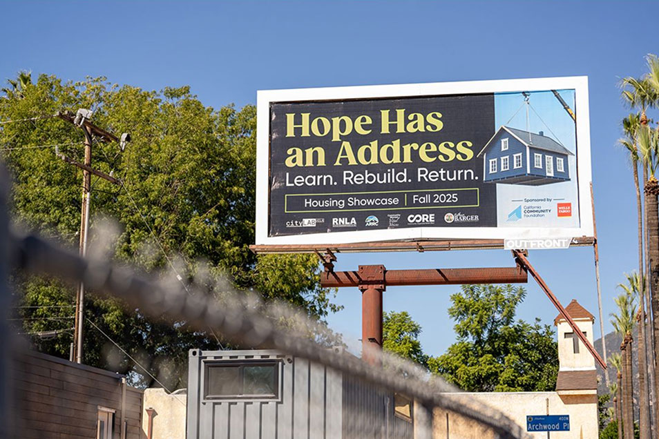 Street view of a billboard 'Hope Has an Adddress Learn. Rebuild. Return. Housing Showcase Fall 2025'